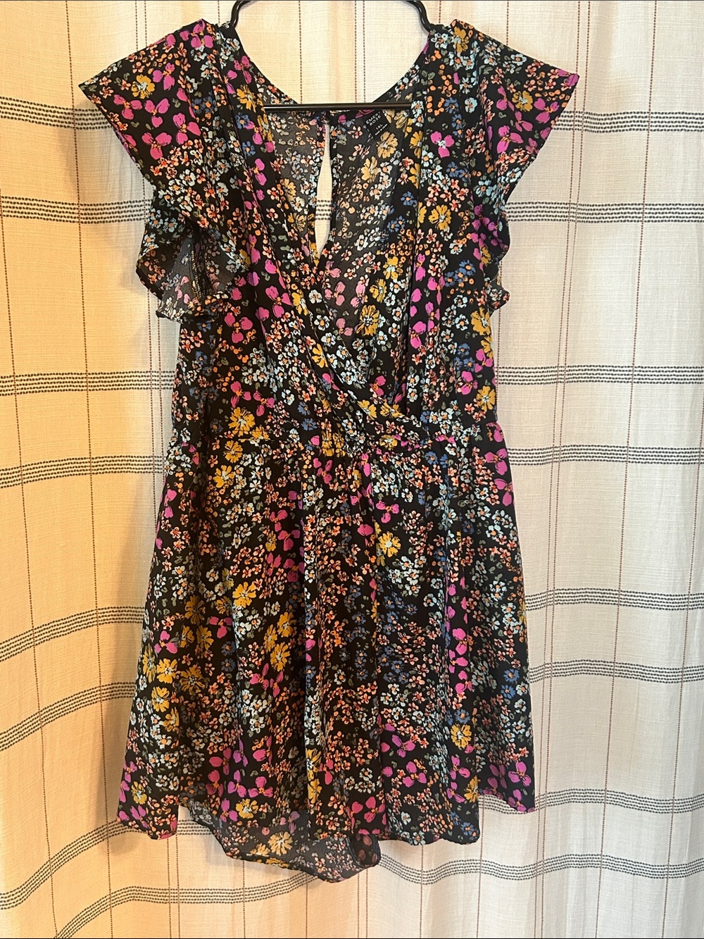 Black Floral Wrap-Style Romper with Pink & Mustard Accents
